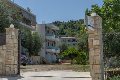 a gate in front of a apartment building at Koks’ Guesthouse in Himare