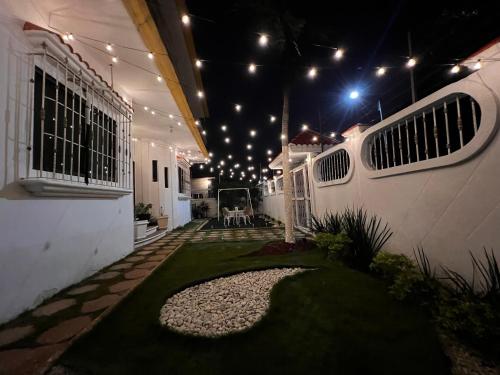 a room with a courtyard with lights on the ceiling at Solar Energy Confort y exclusividad in Minatitlán