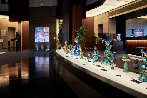 a display of vases on a table in a lobby at Park Hotel Tokyo in Tokyo