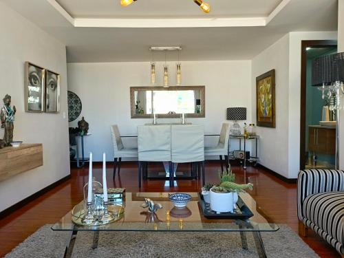 a living room with a table and a couch at CENTRAL Apartment, 3Beds - Balcony - Parking - 6thFLOOR in Quito