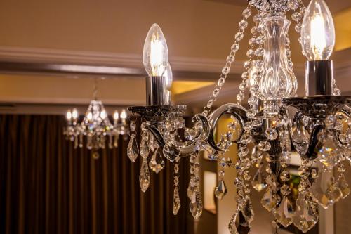 a silver chandelier hanging from a ceiling at コスタリゾート茅ヶ崎大人専用 in Suka