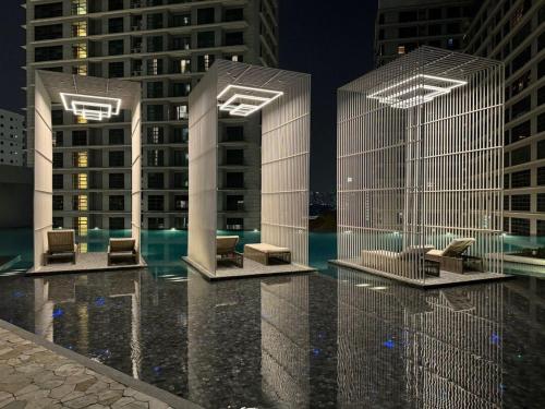 a rendering of a building with chairs and buildings at Humaira Dian Residency Studio Homestay 360sqft in Shah Alam