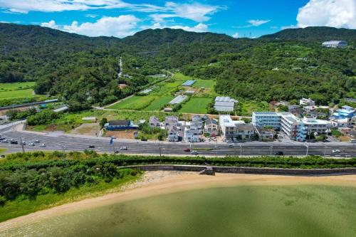 an aerial view of a city and a parking lot at 美らVacation in Onna