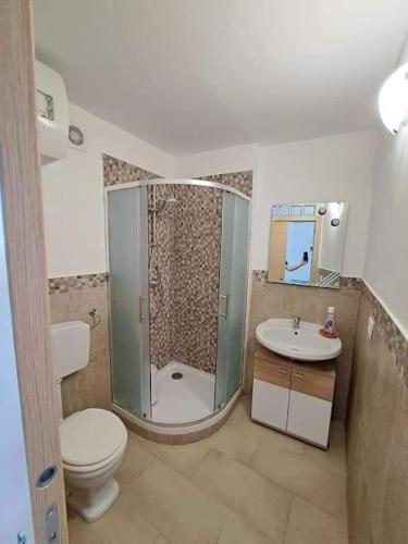 a bathroom with a shower and a toilet and a sink at Casa Vacanze Vista Mare in Agrigento
