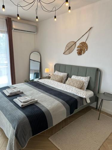 Postel nebo postele na pokoji v ubytování Daisy Apartment 27