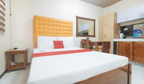 Postel nebo postele na pokoji v ubytování RedDoorz at GaDi Hotel San Jose del Monte City