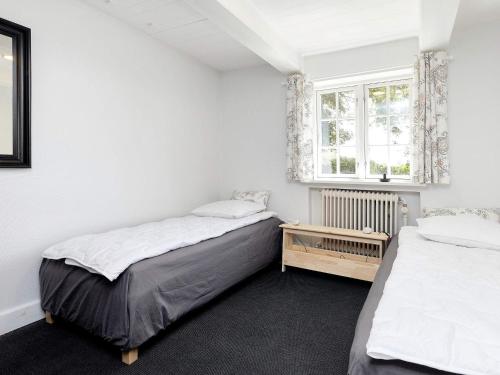 a bedroom with two beds and a window at 6 person holiday home in Store Heddinge-By Traum in Store Heddinge