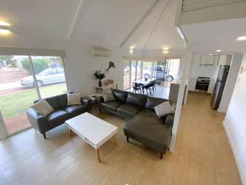 a living room with a couch and a table at Osprey Holiday Village Unit 106 in Exmouth