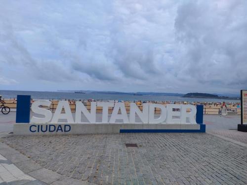 a sign for santander gulfadi on a beach at APARTAMENTO con ESTILO en el CENTRO -Stylish Apartment in the Center in Santander