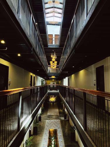 an empty building with a long hallway with a ceiling at Patio by Balai Norte in San Juan