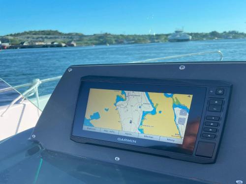 a tablet with a map on the side of a boat at 6 person holiday home in BØMLO in Bømlo