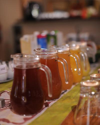 a group of glass mason jars filled with honey at The Waterfront, Maun in Maun