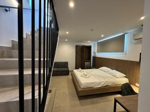 Ένα ή περισσότερα κρεβάτια σε δωμάτιο στο Delfinia Luxury Residence