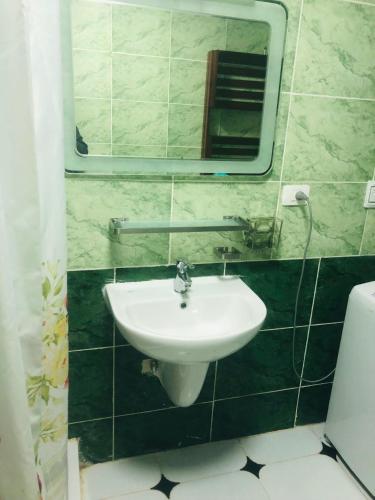 a bathroom with a sink and a mirror at Paradise Gates Golden Beach two in Ras Sedr