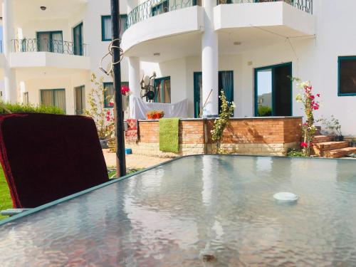 a pool in the backyard of a house at Paradise Gates Golden Beach two in Ras Sedr