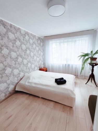 Postel nebo postele na pokoji v ubytování Kuressaare Rohu Apartment