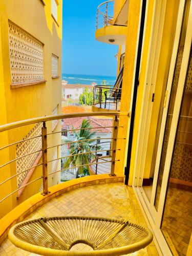 a view from the balcony of a building with a spiral staircase at Elna's Nyali - Work & Unwind - Pool, Sea Views, AC & Fast Wi-Fi in Mombasa