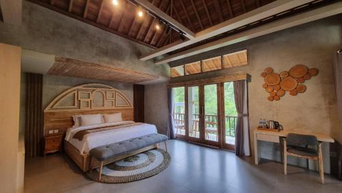 Postel nebo postele na pokoji v ubytování Gandatera Ubud
