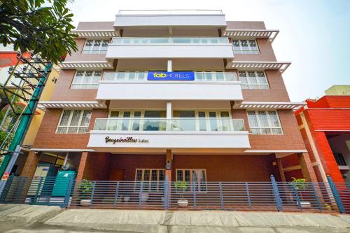 a building with a sign on the front of it at FabHotel Bougainvillea Suites - Horamavu in Bengaluru