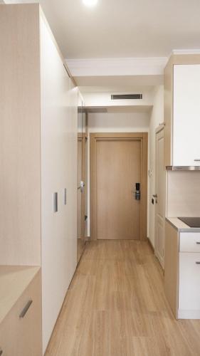an empty hallway of an apartment with a door at Hide Apart Hotel in Aktau