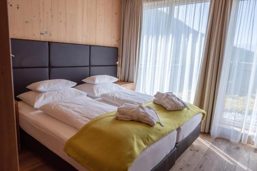 Postel nebo postele na pokoji v ubytování Alpresort Tirol