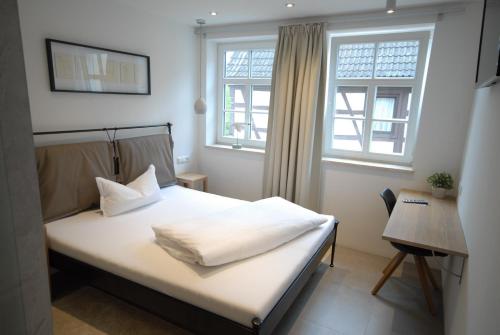 Postel nebo postele na pokoji v ubytování Bella Riva Hotel