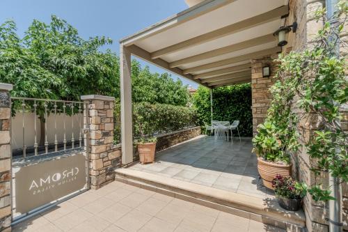 an entrance to a house with an awning at Chroma Pelion Villas in Kato Gatzea
