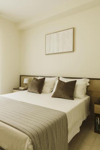 Postel nebo postele na pokoji v ubytování Residenze Roscioli