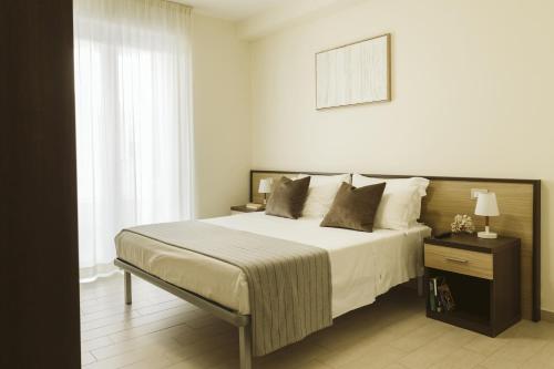 Postel nebo postele na pokoji v ubytování Residenze Roscioli