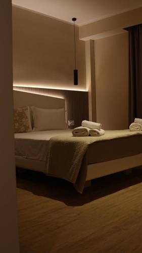 a bedroom with a bed with two towels on it at Residenza Gurnea - Free Private Parking in Tropea