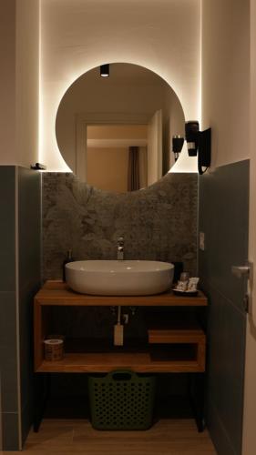 a bathroom with a sink and a mirror at Residenza Gurnea - Free Private Parking in Tropea