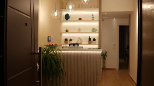 a room with a counter with potted plants on shelves at Residenza Gurnea - Free Private Parking in Tropea