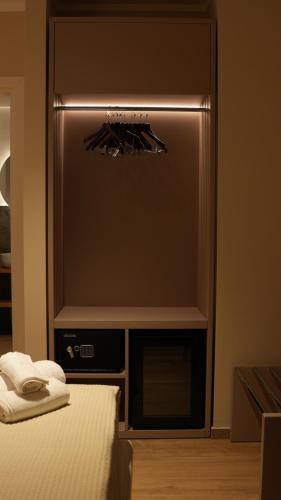 a bedroom with a bed and a tv in a room at Residenza Gurnea - Free Private Parking in Tropea