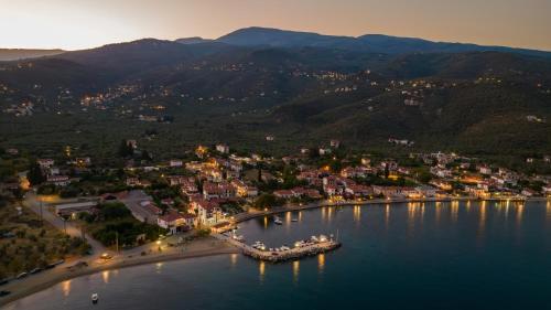 an aerial view of a small island in a body of water at Chroma Pelion Villas in Kato Gatzea