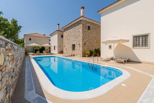 an image of a swimming pool in a villa at Chroma Pelion Villas in Kato Gatzea