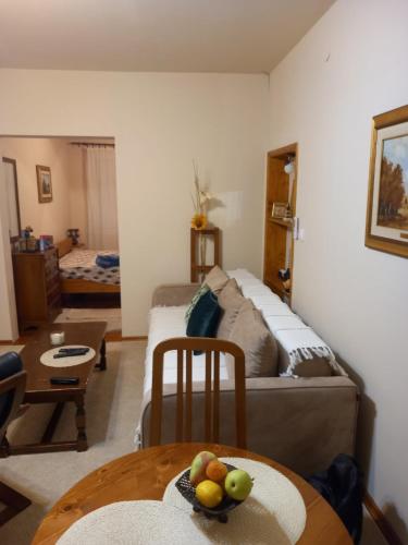 a living room with a couch and a table at No name apartment in Bajina Bašta