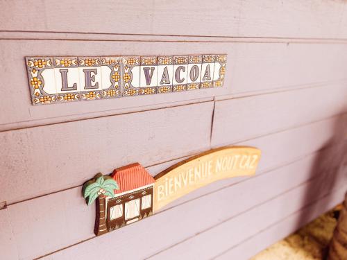 a sign on a wall with a train on it at 12 - LE VACOA - CHAMBRE 12 ETG D in Saint-Paul