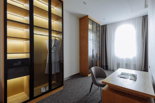 a dressing room with a desk and a closet at Old Ijevan Boutique Hotel in Ijevan