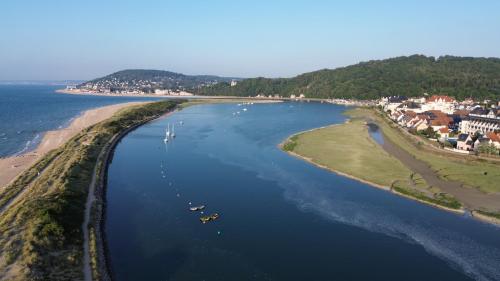 an aerial view of a river with boats in it at L'échappée Cabourgeaise in Cabourg
