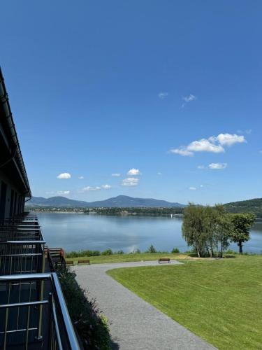 a view of a lake from a building at Noclegi Laguna in Żywiec