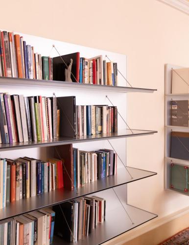 a row of shelves filled with books at Palazzetto Pisani Grand Canal in Venice