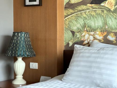 Postel nebo postele na pokoji v ubytování Grand Orlov Apart Hotel