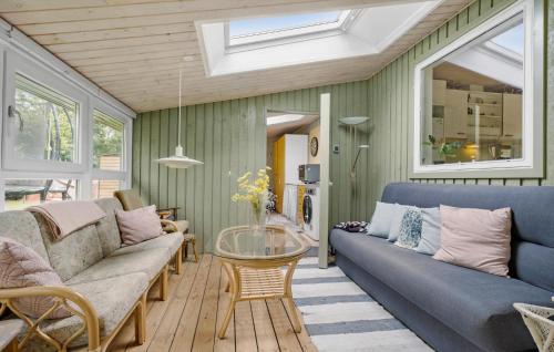 a living room with a couch and a table at Amazing Home In Højby With Wifi in Højby