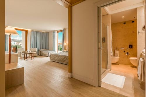 Posezení v ubytování Smy Carlos V Wellness & Spa Alghero