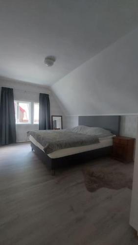 a bedroom with a bed in a room at Old Town House in Rjukan