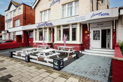 a restaurant with tables in front of a building at Lanayr Hotel in Blackpool