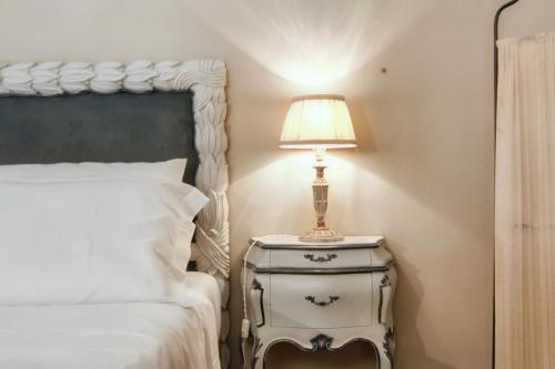 Postel nebo postele na pokoji v ubytování Castellare Loft appartamento in collina a Firenze