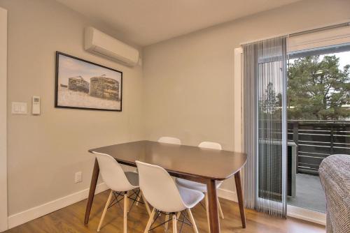a dining room with a table and chairs and a window at Blueground Mtn View gym pool nr university SFO-1670 in Mountain View