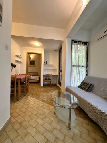 a living room with a couch and a table at Kornelija 2 in Podgora
