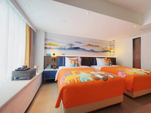 Katil atau katil-katil dalam bilik di Mehood Lestie Hotel Maoming High-speed Railway